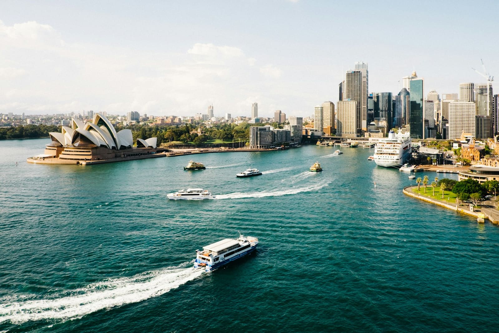 Sydney harbour on a clear day, with the Opera House and the city skyline across the water