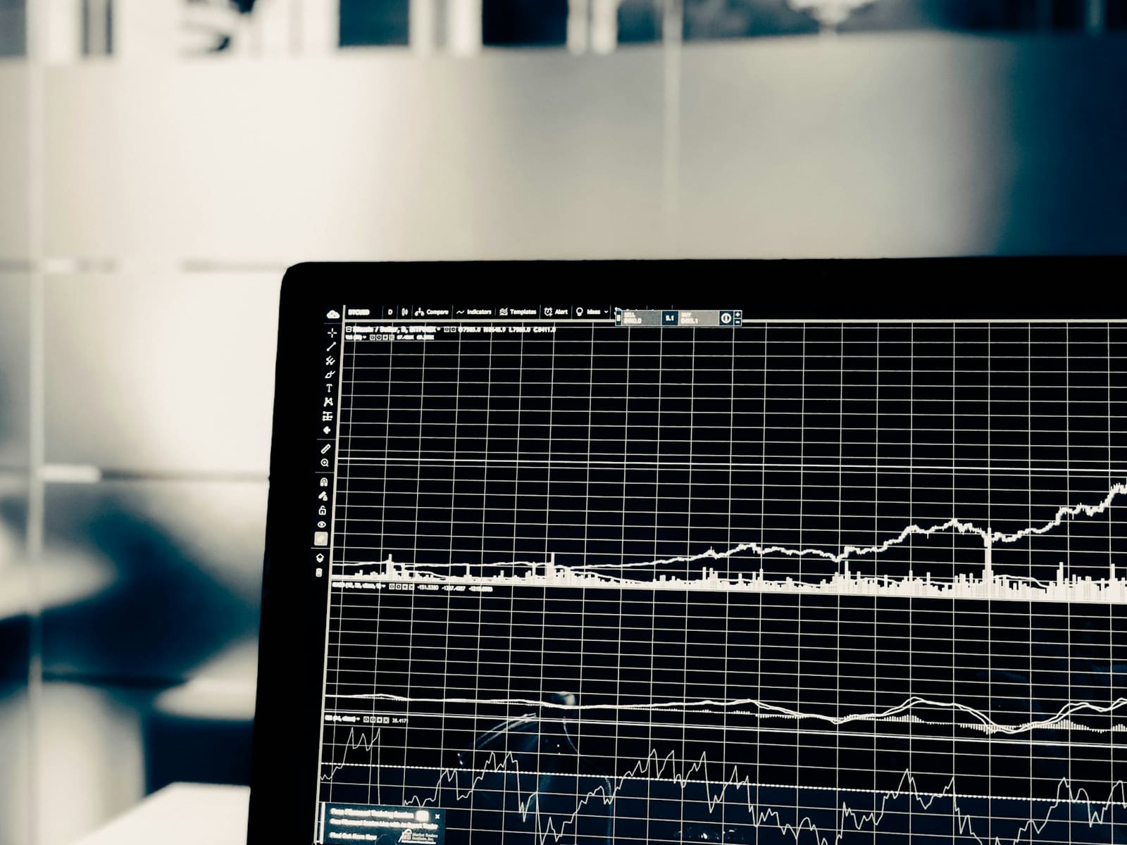 A trading terminal showing several stacked price charts on a grid of fine lines